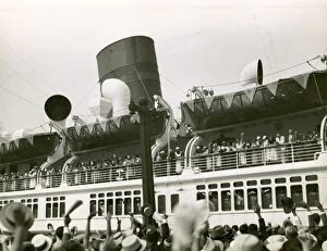 Crowd cheering at ship leaving