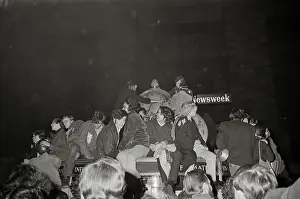 Crowd Defacing a Clock