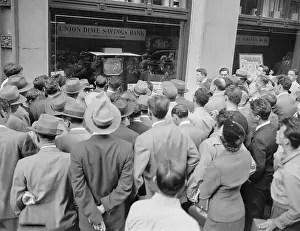Crowd Gazing in Window at Television