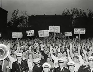 Crowd Holding up Signs