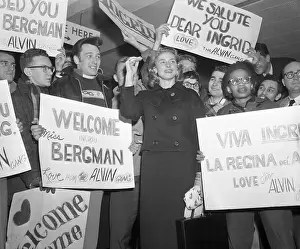 Crowd Holding Welcome Signs