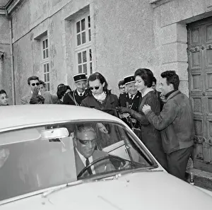 Crowd near Aristotle Onassis Driving Automobile
