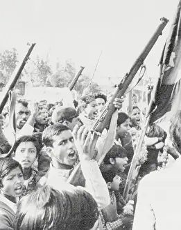 Dhaka Prints: Crowd Raising Guns in Celebration
