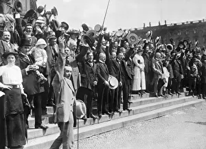 Crowd on Steps with Raised Hats Singing