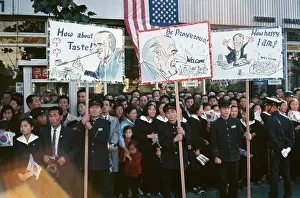 Crowd on Street in Korea With Signs