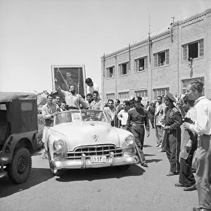 Shah Prints: Crowd in Street with Portrait of Shah