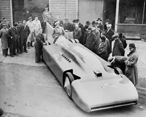 Racecar Prints: Crowd Surrounding Sleek Racecar