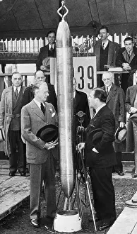 A Crowd Watches as a Time Capsule in Buried