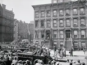 Crowd Watching Police Remove a Body From a House
