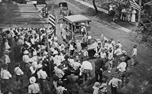 Prints of High-angle shot of a crowd gathered near a truck carrying the Justice Bell, a replica of the Liberty Bell cast by Pennsylvanian suffragists, used for campaigning between 1915 and 1920, Pennsylvania Historic Moments from the Women’s Fight for the Vote: Crowd Watching Suffragists