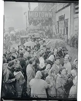 Crowds Waiting in Snow for Sale Items