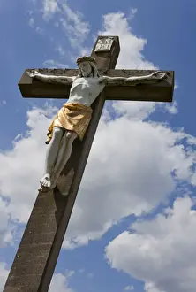 Roadside Prints: Crucifix, wayside cross against a blue sky with white clouds