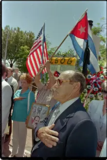 Anniversary Prints: Cuban Exile Covering Heart During Anthem
