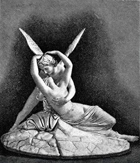 Cupid and psyche statue embracing each other with spread wings