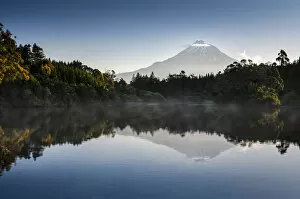 Images Dated 30th November 2011: Currently inactive volcano, Mt Egmont, Mt Taranaki, reflections in Lake Mangamahoe reservoir, dam