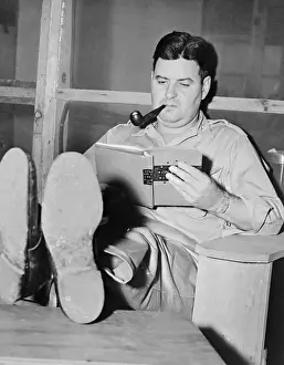 Curtis E. LeMay Relaxing with Feet Up