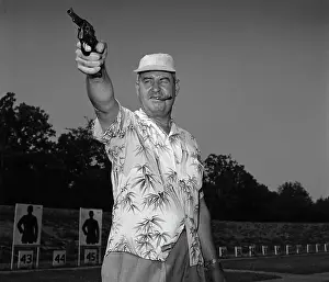 Curtis LeMay Holding Pistol