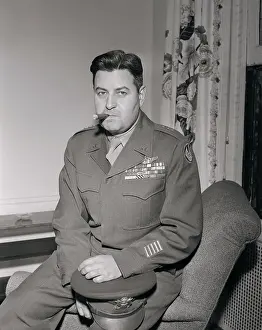 Curtis LeMay Sitting on Arm of Chair