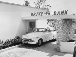 Convenience Prints: Customer Making Deposit at Drive Through Window