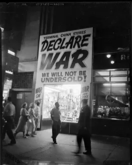 On Sale Prints: Customers Enter Store with Huge Sale Sign