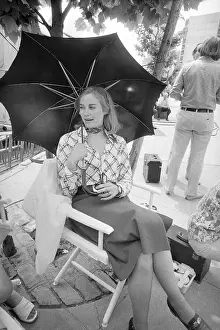 Cybill Shepherd Holding an Umbrella