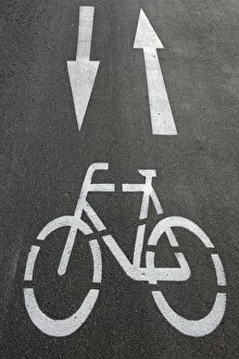 Cycle path, directional arrows, road markings on the asphalt