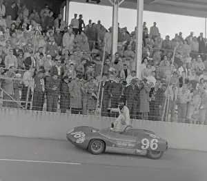 Dan Gurney Climbing into His Race Car