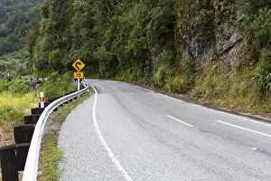 Roadside Prints: Dangerous curve warning sign, road with a dangerous curve