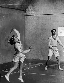 Prints of 19th March 1949: Danish badminton players Kirsten Thorndahl and John Skarrup playing at Harringay, London. Original Publication: Picture Post - 10091 - How To Play Badminton - pub A Photographic Legacy: Danish Players