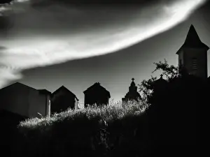 Prints of Shadows and strange clouds work together above the cemetery in St Martin de L'Arcon, France Travel Imagery Prints: Dark Shadows