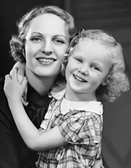 Daughter w / arm around mother