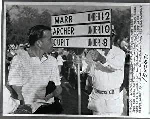 Dave Marr Looking at Scores