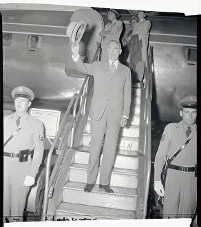Dean Acheson Waving from Plane Steps