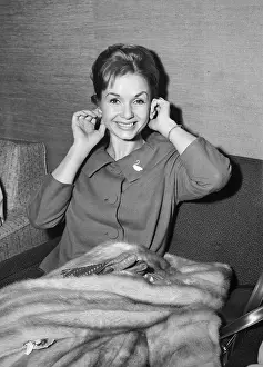 Debbie Reynolds At Airport, Holding Ears
