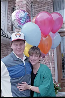 Spouse Prints: Debbie and Roger Clemens Hug with Balloons