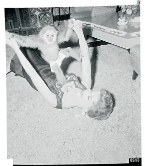 Debra Paget Playing with Her Pet Gibbon