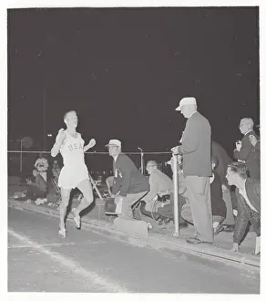 Pomona Prints: Bill Dellinger Hitting Tape