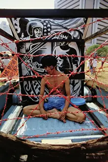 Manila Prints: Demonstrator Enacting Suffering