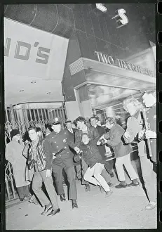 Demonstrator Being Pulled Away