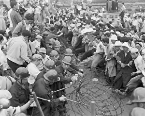 Demonstrators at Barbed Wire