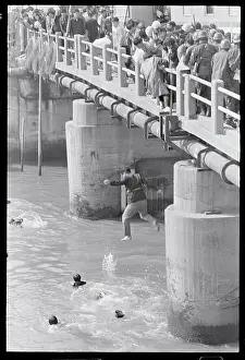 Demonstrators Jumping into a River
