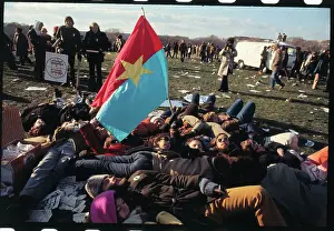 Demonstrators Laying on Ground with Viet Cong Flag