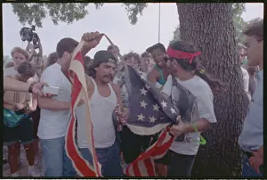 Demonstrators Shredding American Flag