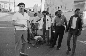 Racial Prints: Demonstrators With Wounded Colleagues