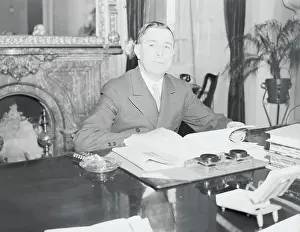 Dennis Chavez Seated at Desk