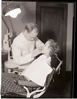 Teeth Prints: Dentist Examining Patients Teeth
