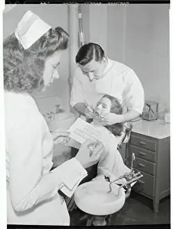 Dentists Performing a Dental Examination