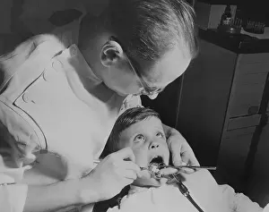 Dentists Working on Child