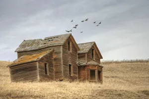 A derelict ranch in a prairie setting