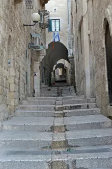 Historic Center Collection: Deserted alleyway with Israeli flag hanging from a window above an archway, Muslim Quarter